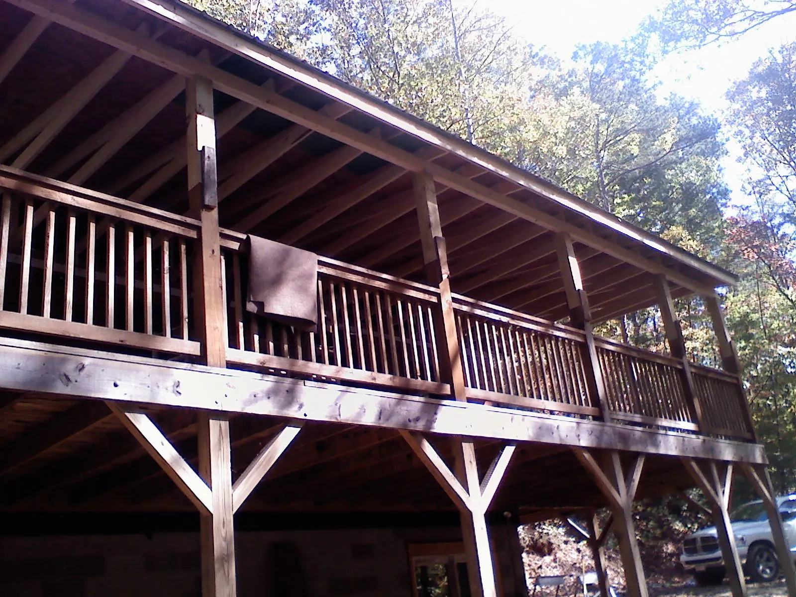 Timber framing under a new elevated porch and deck in Glendale Springs